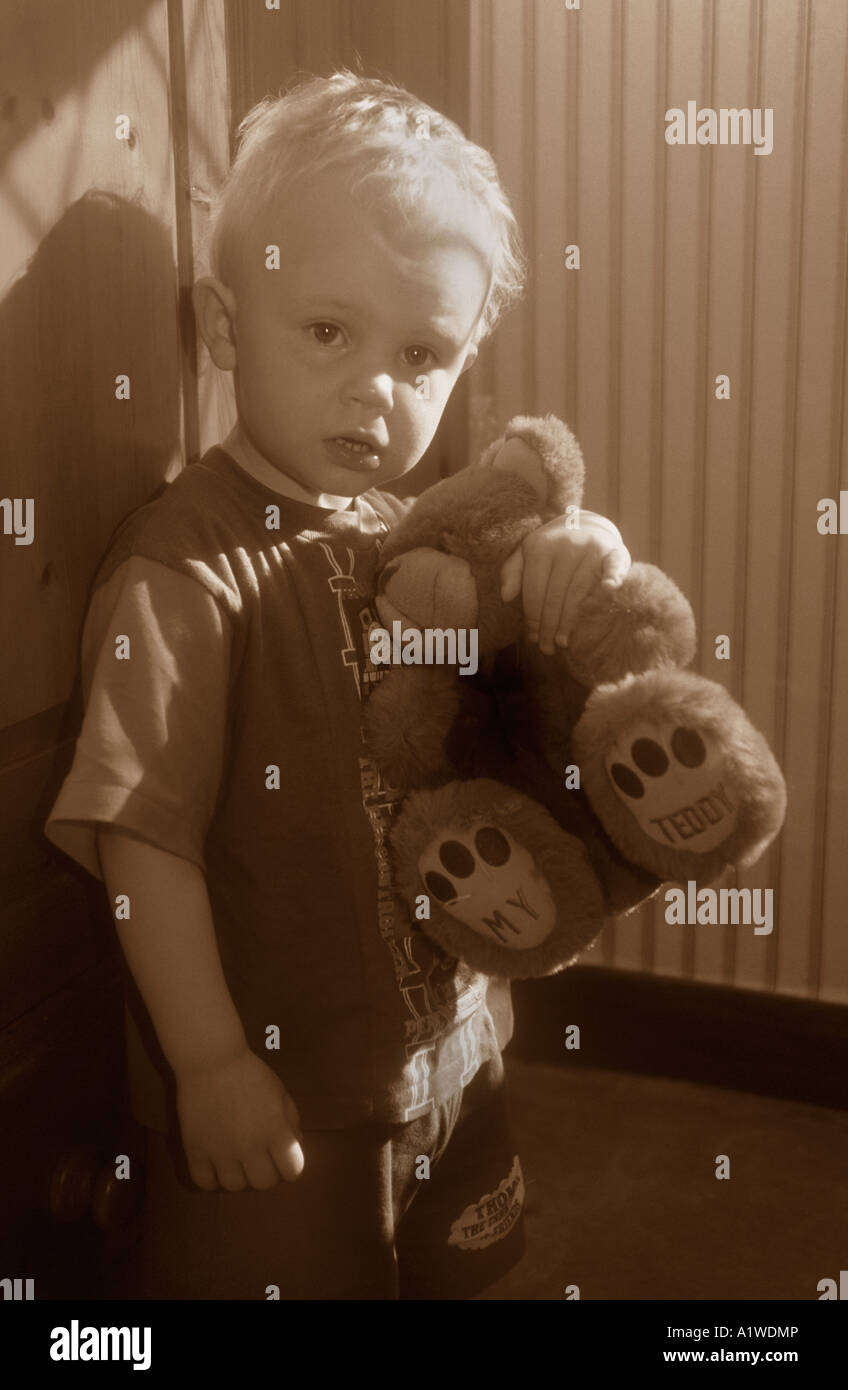Little Boy Holding One Of His Teddy Bears Stock Photo - Alamy