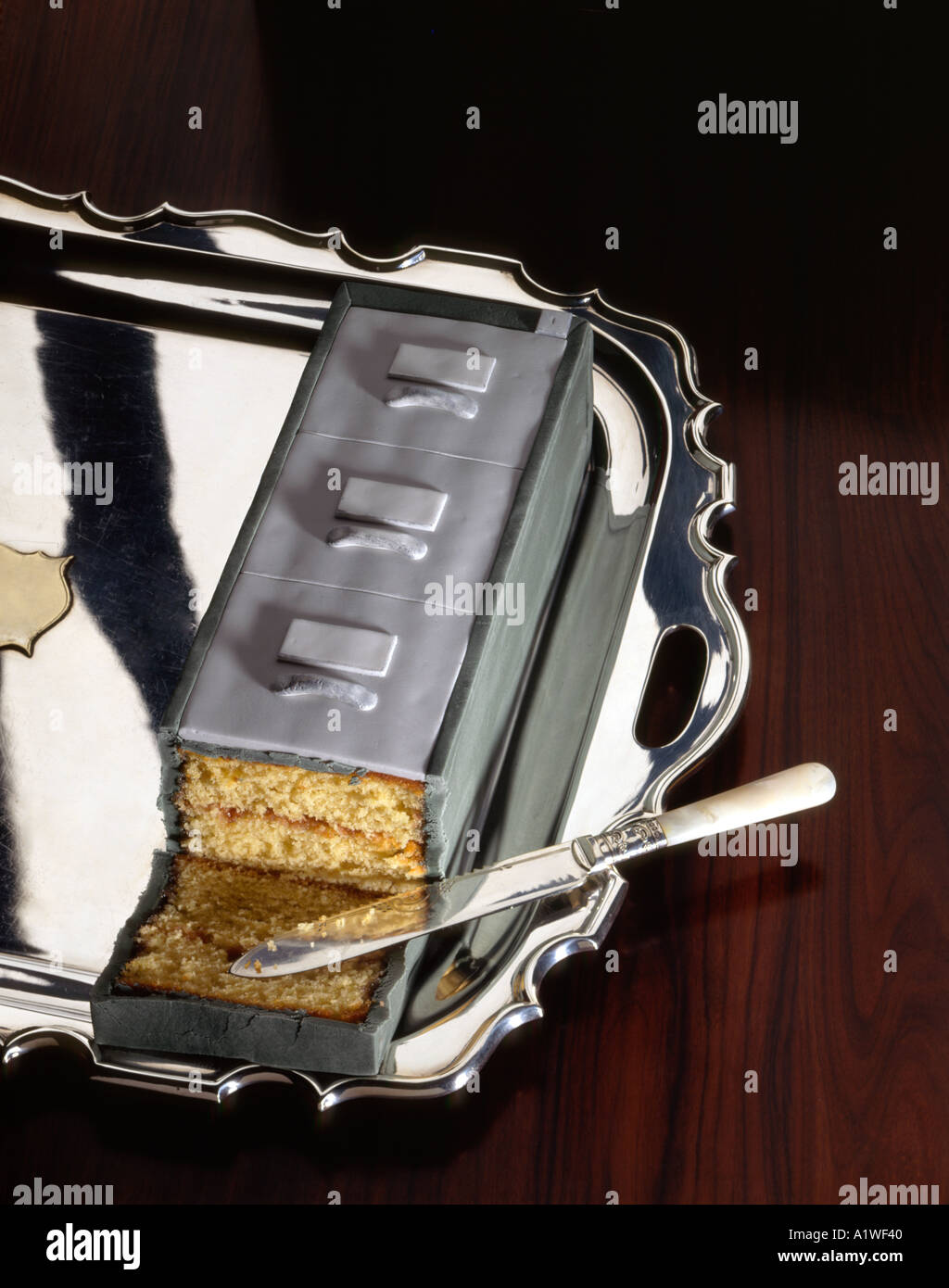 sponge cake icing as a filing cabinet on a silver plater Stock Photo