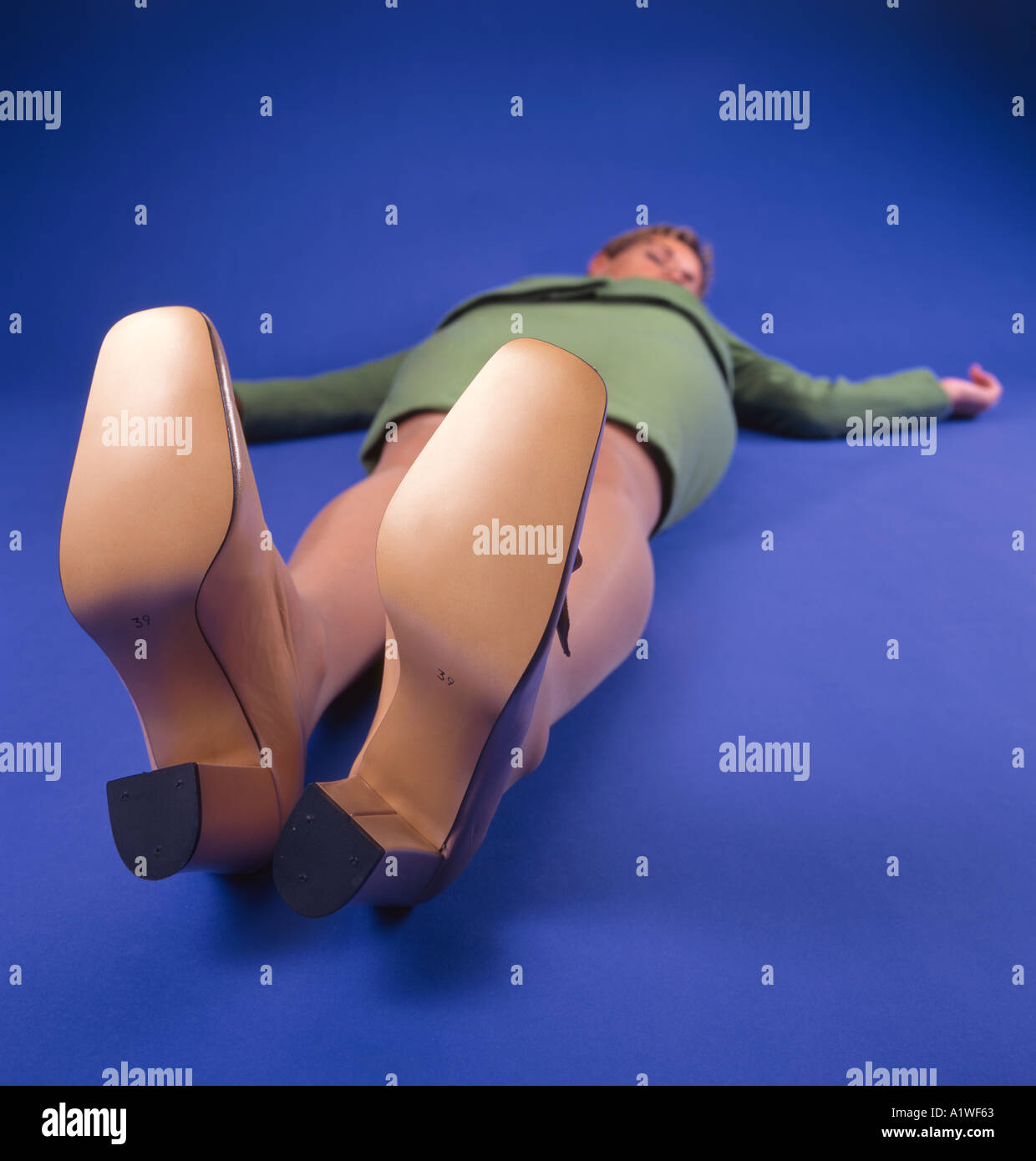 secretary lying on the ground unconsious Stock Photo