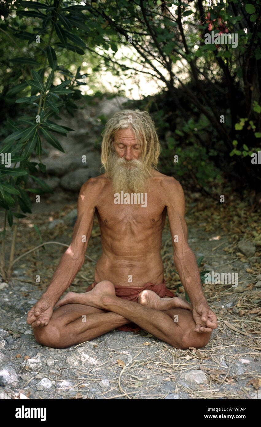 Yogi who resides in Crete meditating in full lotus yogi position Stock Photo