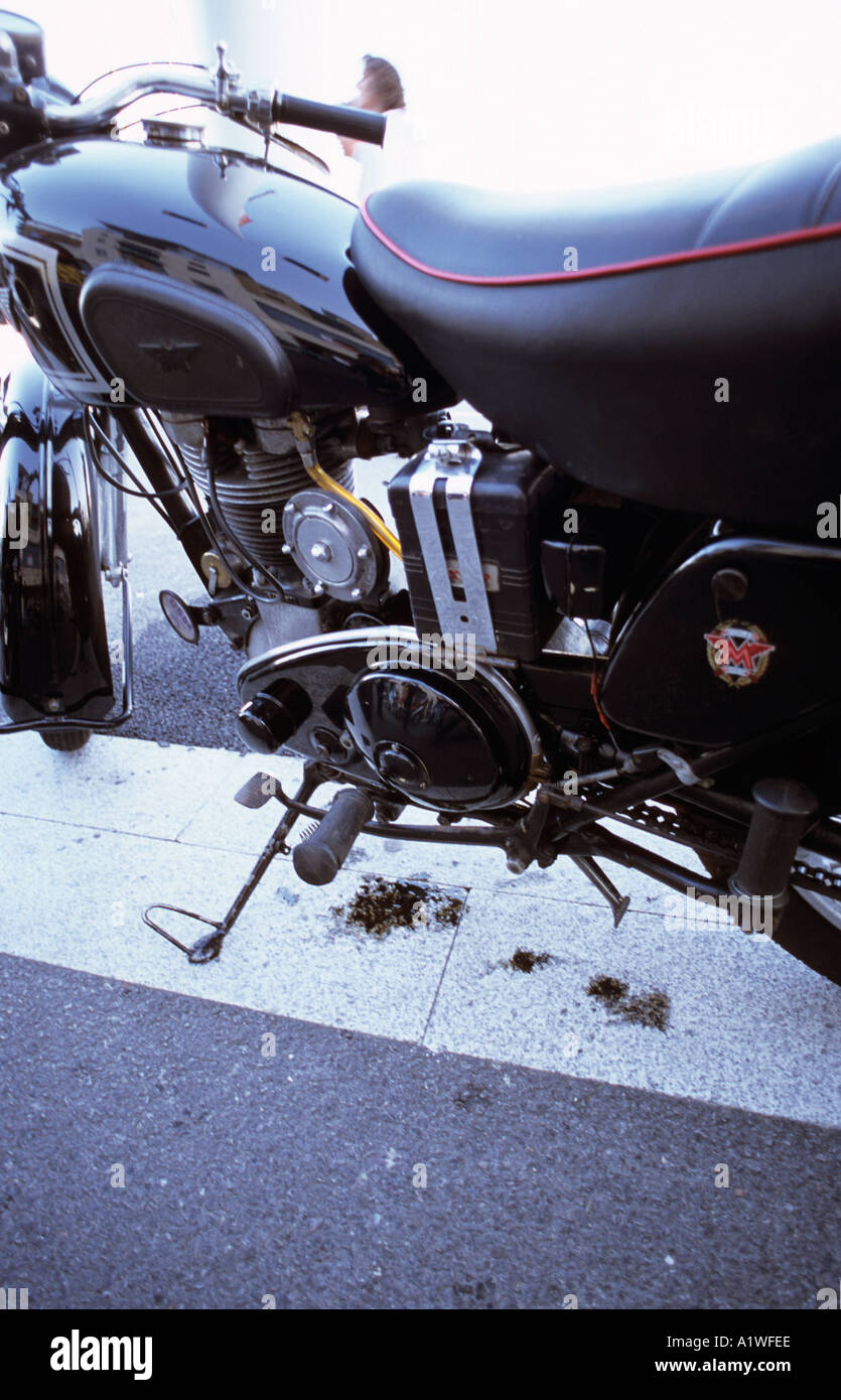 A classic motorcycle leaking oil Stock Photo Alamy