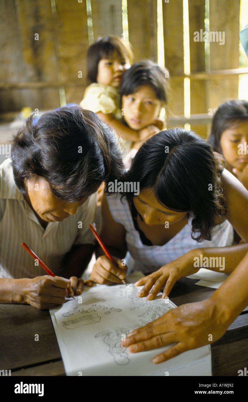 WOMEN DRAWING AT A SILKSCREEN WORKSHOP PERU Stock Photo
