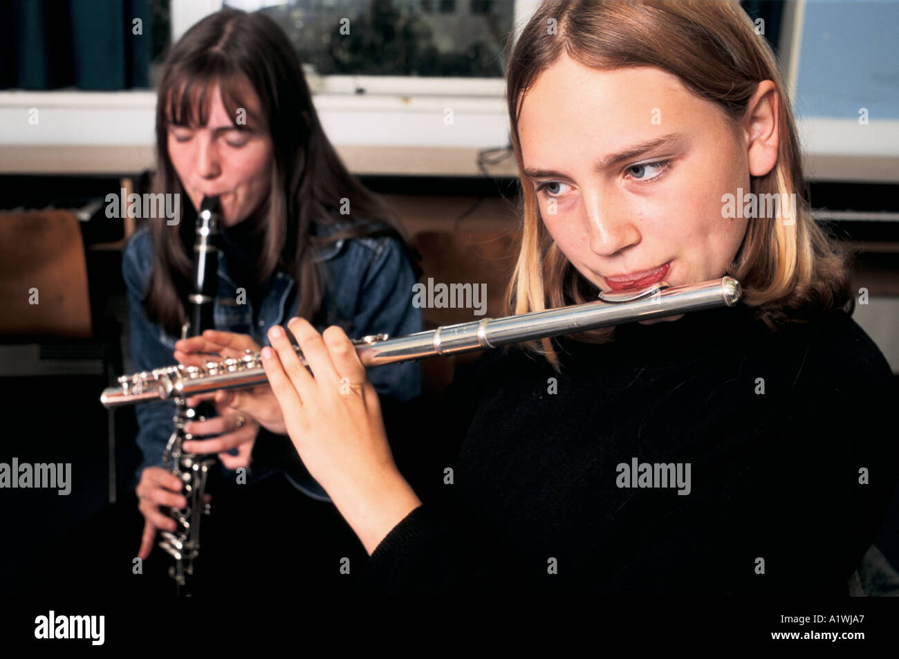 MUSIC LESSON FOR YEAR 12 .LEARNING TO PLAY THE FLUTE AND CLARINET 2000 Stock Photo