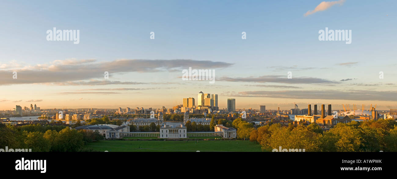A 2 picture stich panoramic view at sunset of Canary Wharf, Maritime Greenwich and the millenium dome - now called the O2 arena. Stock Photo