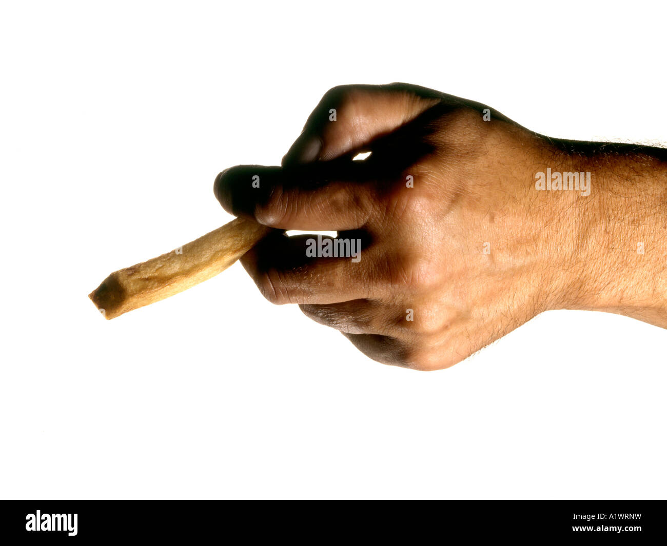 MAN'S HAND HOLDING A CHIP LIKE A CIGARETTE Stock Photo