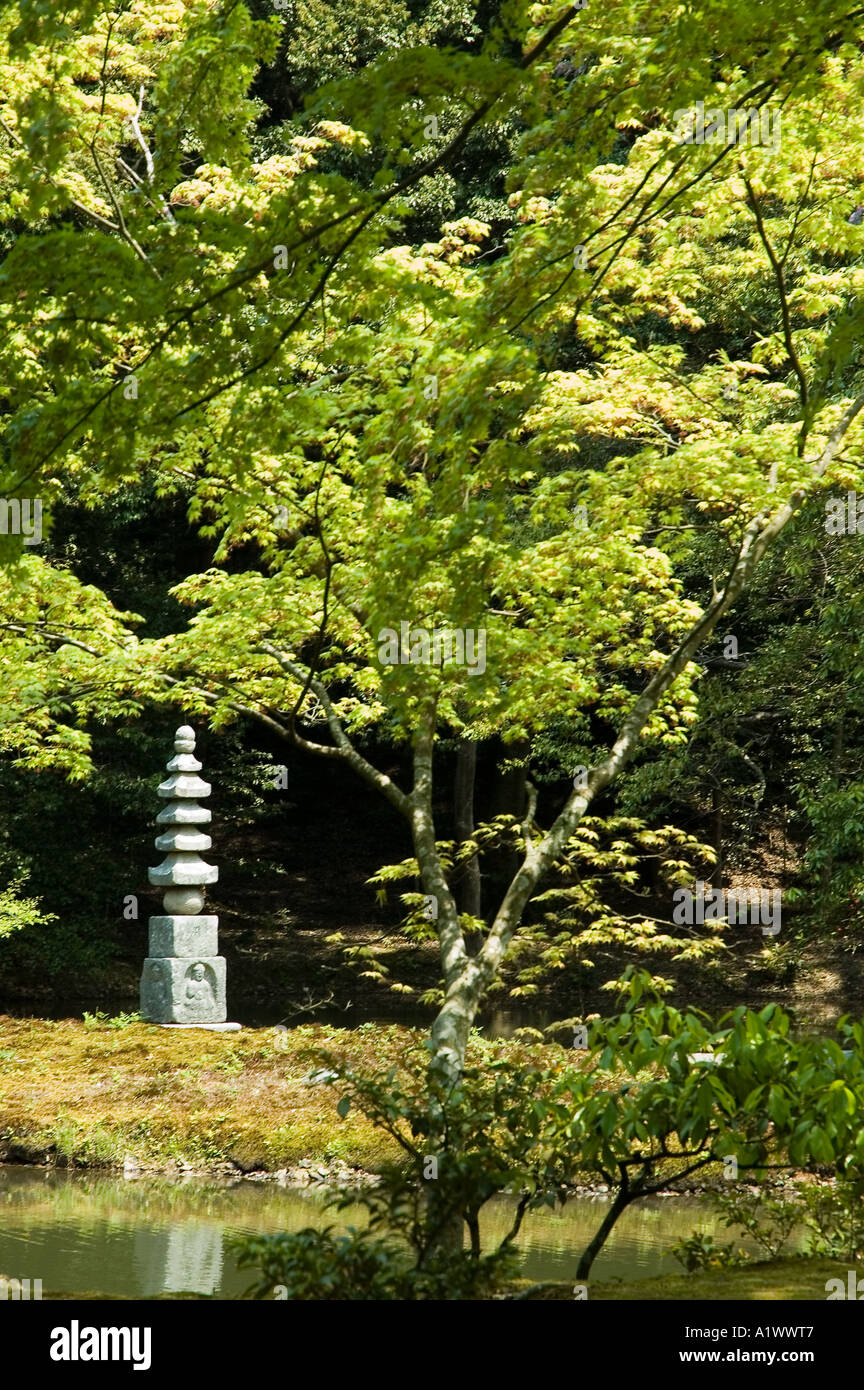 A statue in the gardens of Kinkakuji Temple in Kyoto Japan Stock Photo