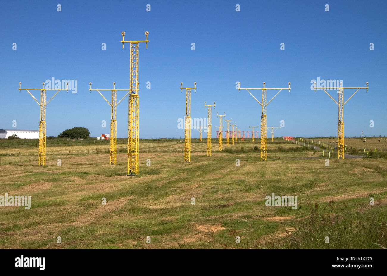 dh KIRKWALL AIRPORT ORKNEY Approach lighting landing system Kirkwall runway masts Stock Photo