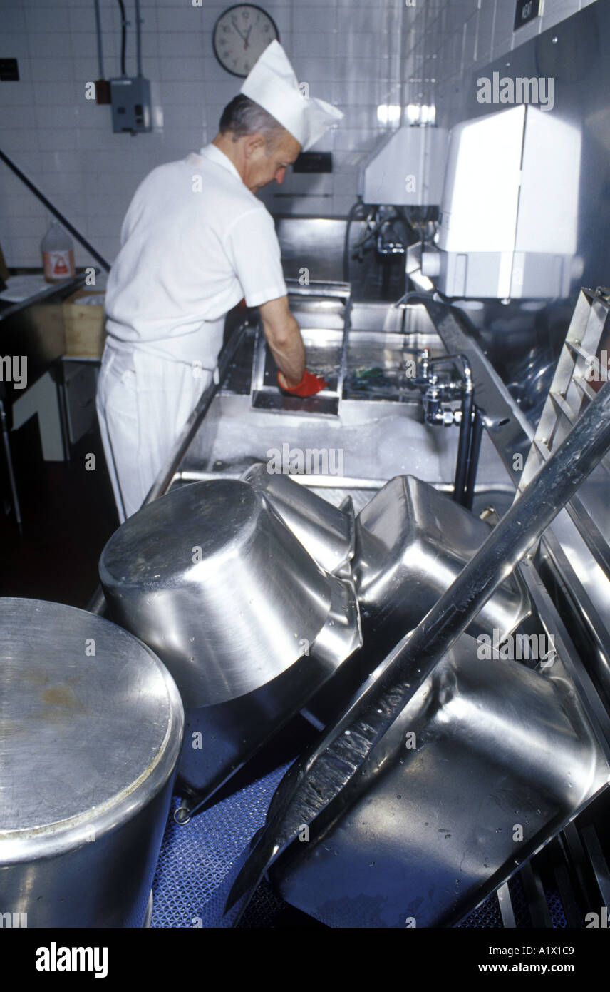 Potwasher working in a commercial kitchen Stock Photo Alamy