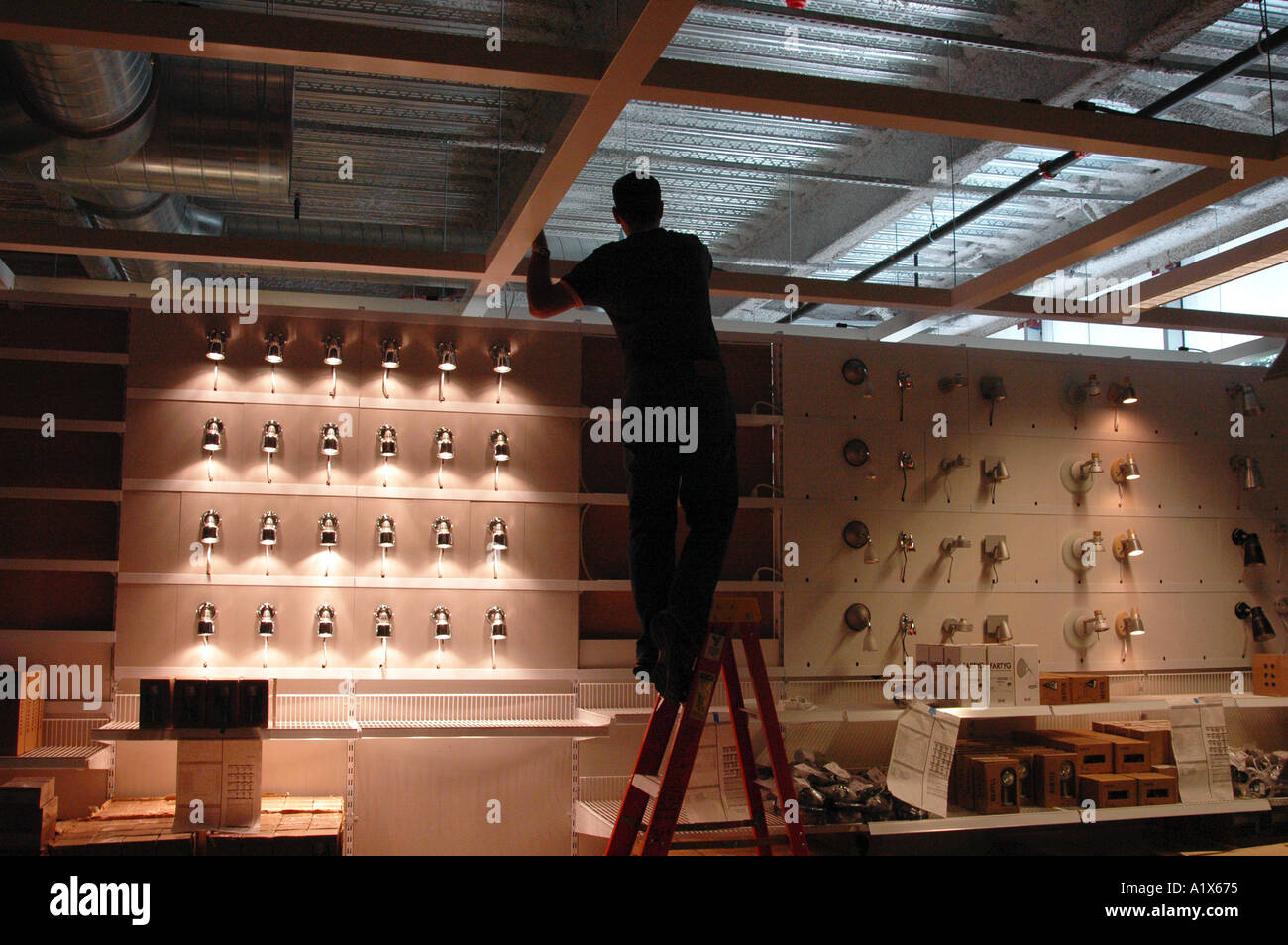 Lighting designer working on a display at a new Ikea home furnishing store in New Haven Connecticut USA United States Stock Photo