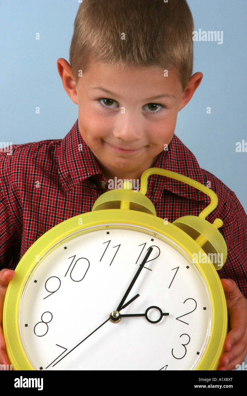 boy with an alarm clock Stock Photo