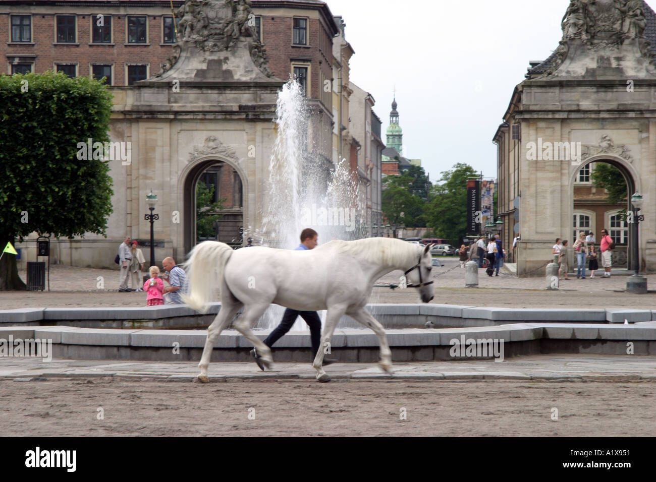 Soldier exercising a horse outside the Christiansborg Palace in Copenhagen Stock Photo