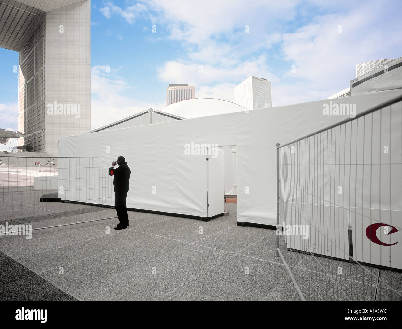 Security person having a break at a trade fair at La Defense, Paris, France. Stock Photo