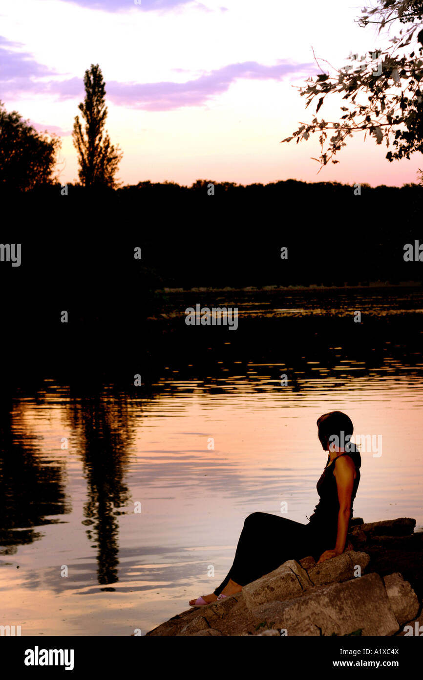 lady on the riverbank Stock Photo - Alamy