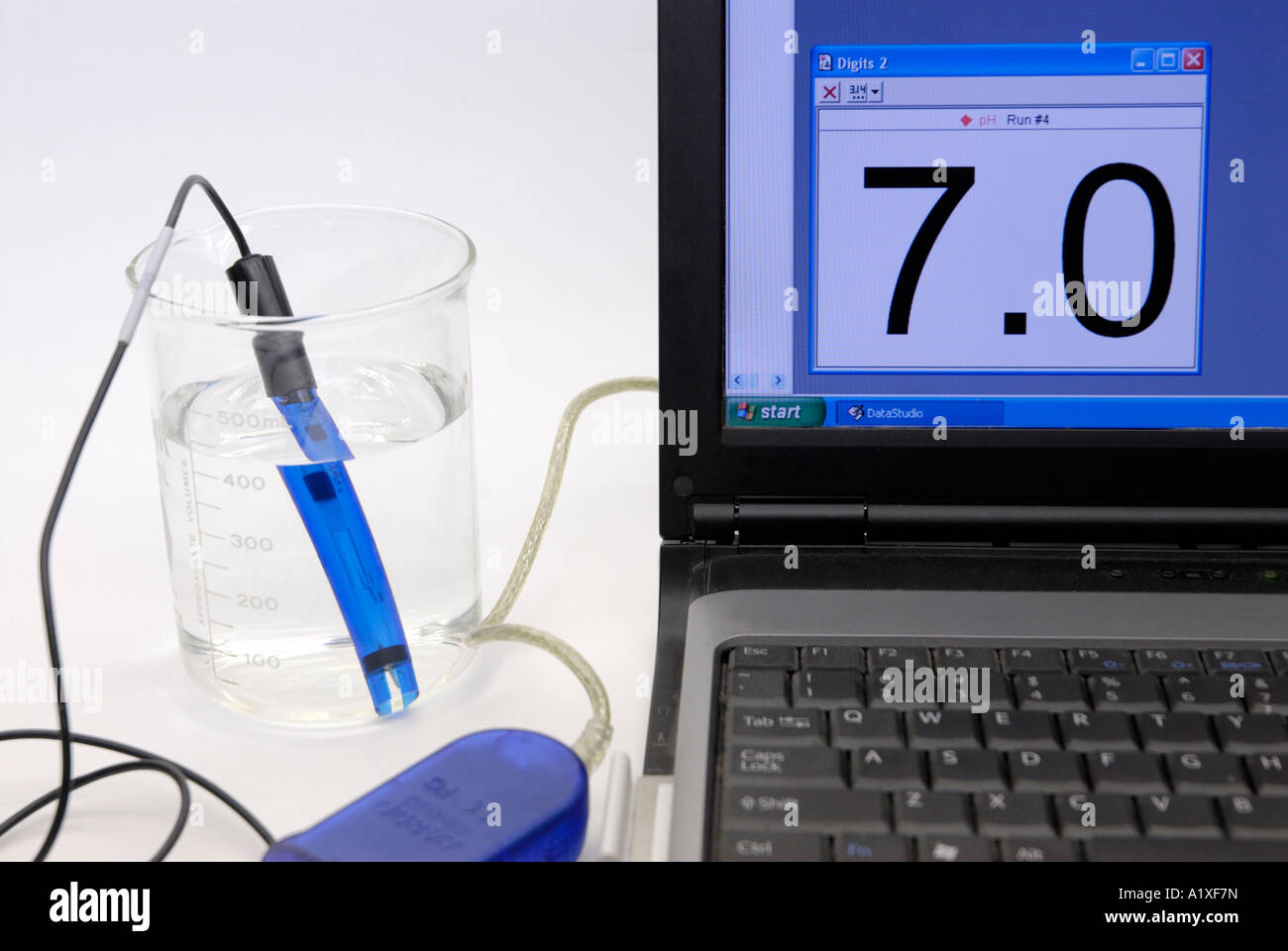 Digital pH sensor measuring the pH of pure water showing it to be 7.0 Stock Photo