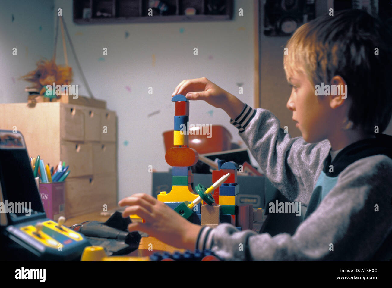 BOY PLAYING WITH BLOCKS Stock Photo - Alamy