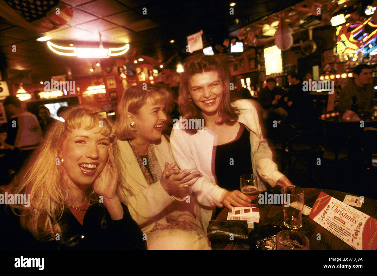 YOUNG WOMEN DRINKING AN A THEME PUB MILTON KEYNES 1997 Stock Photo