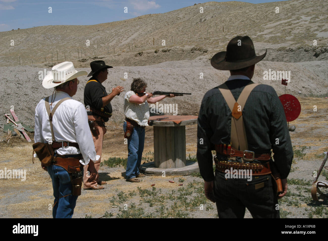 Members of Colorado gun club the Comanche Valley Vigilantes take aim and shoot during a dressed up re enactment of scenes from the Wild West using antique firearms Stock Photo