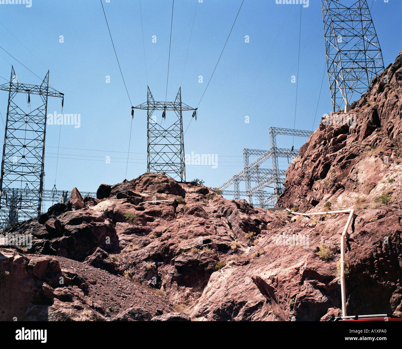 Multiple cables feed through the electricity pylons erected above ...