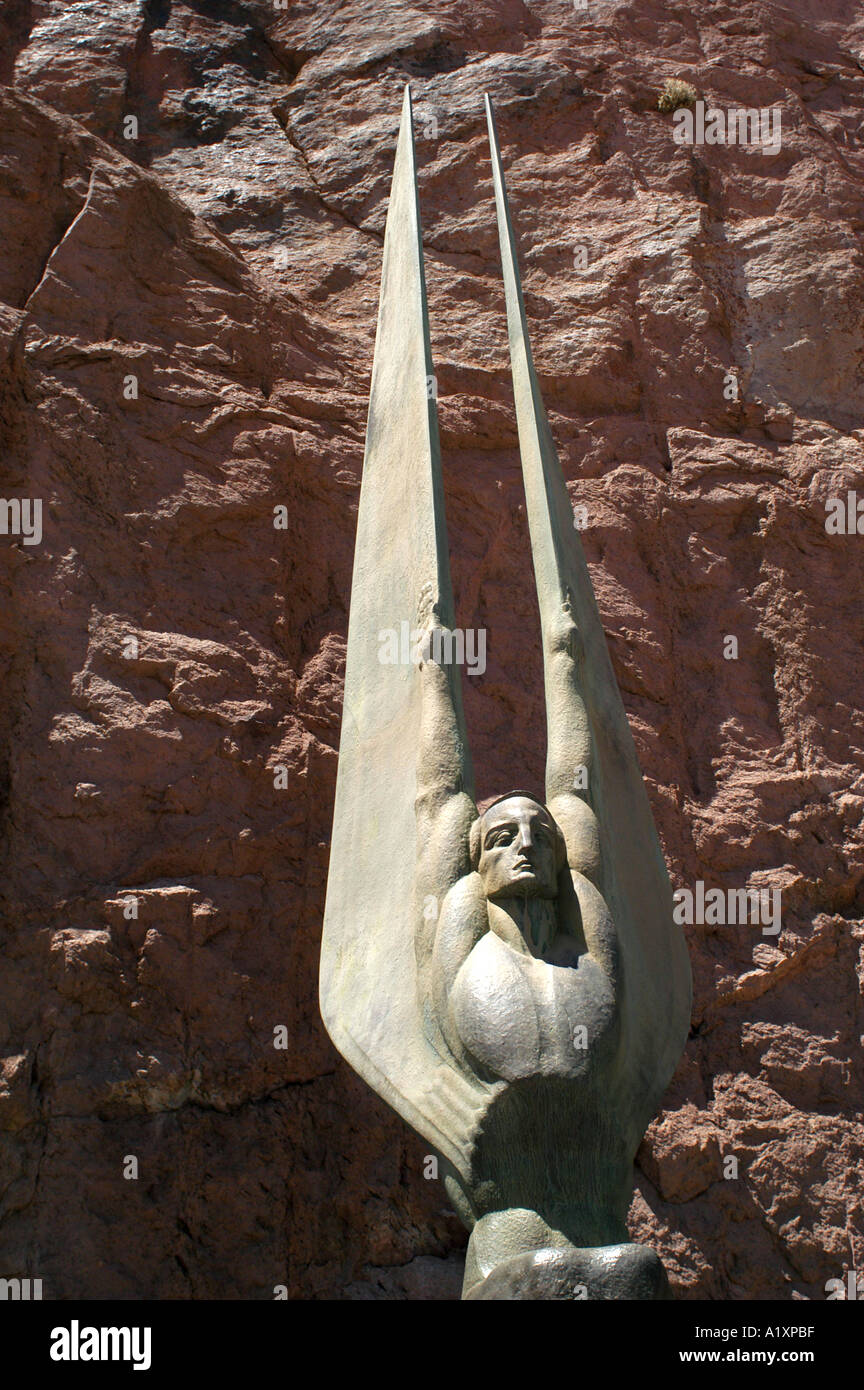 Man with sings Art Deco monument to the 5 000 men who took five years to complete the Hoover Dam built in 1935 to control the violent Colorado River and provide water and hydroelectric power which led to the enlarging and continual growth of Las Vegas Stock Photo