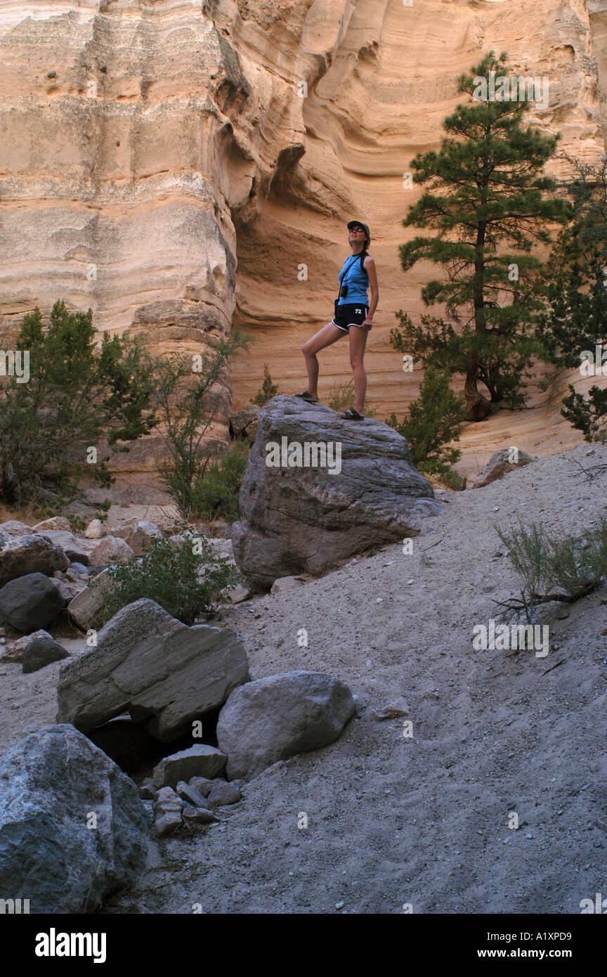 Female hiker looking up to the sandstone walls of a slot canyon Tentrock Cochiti Pueblo Stock Photo