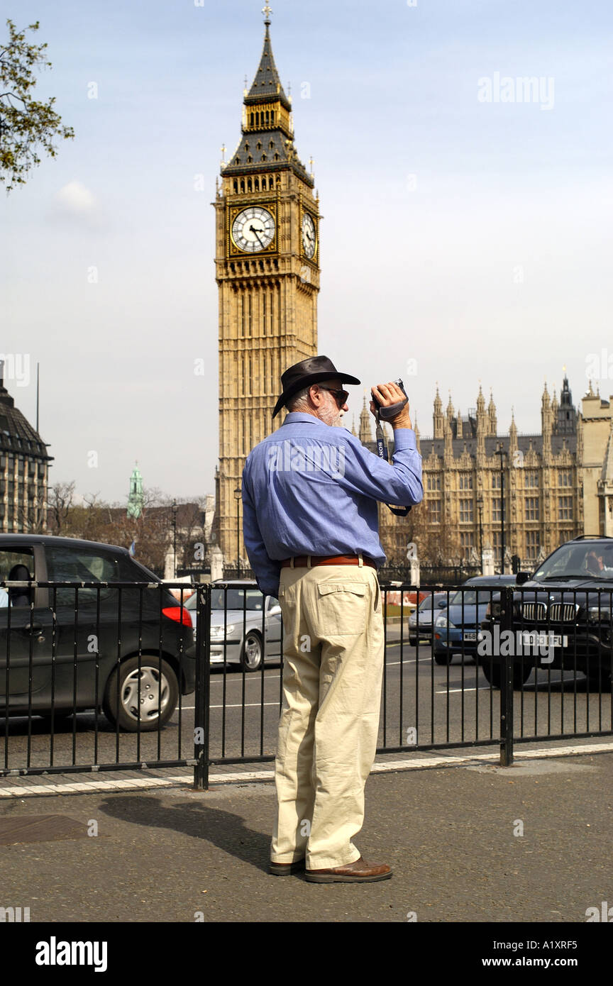 Tourist filming Big Ben, Houses of Parliament, Parliment Square Westminster, London England UK Stock Photo