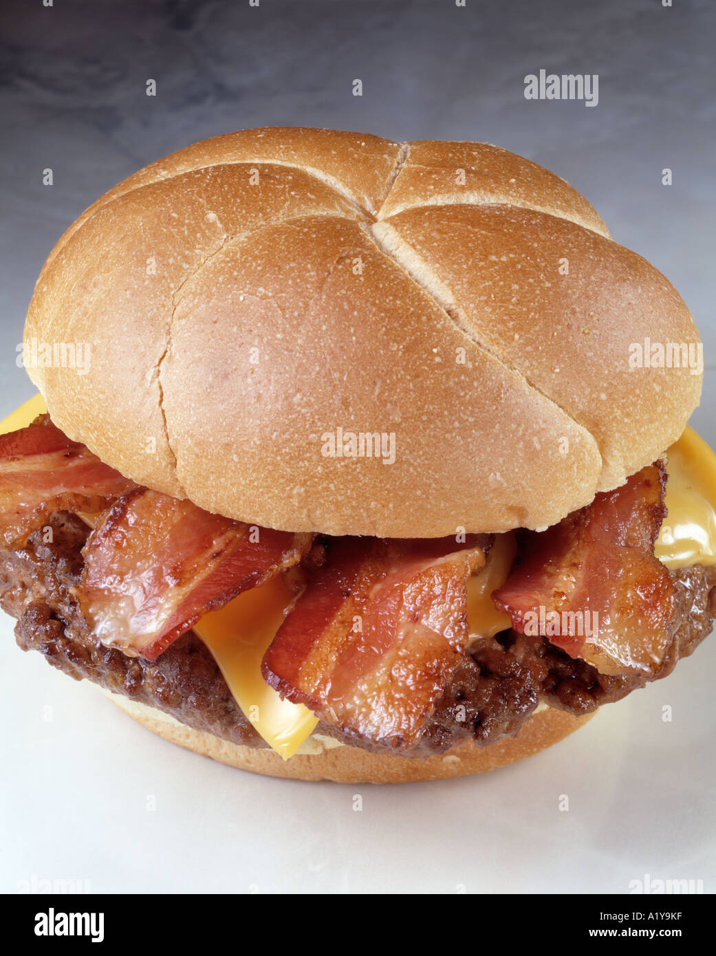 close up burger hamburger cheese cheeseburger bacon kaiser roll bun