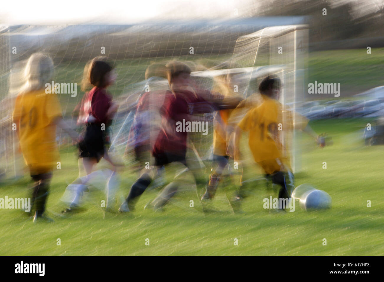 Kids in motion playing soccer stock photo alamy