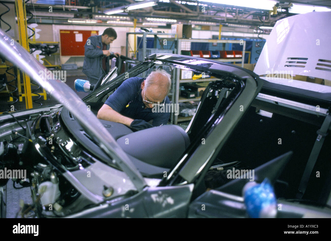 Factory workers assembling hires stock photography and images Alamy