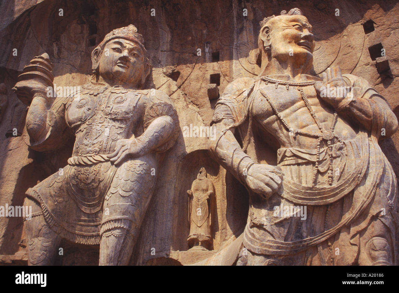 Statues carved in the rock at the Longman Buddhist caves at Luoyang Hunan Province China J Sweeney Stock Photo