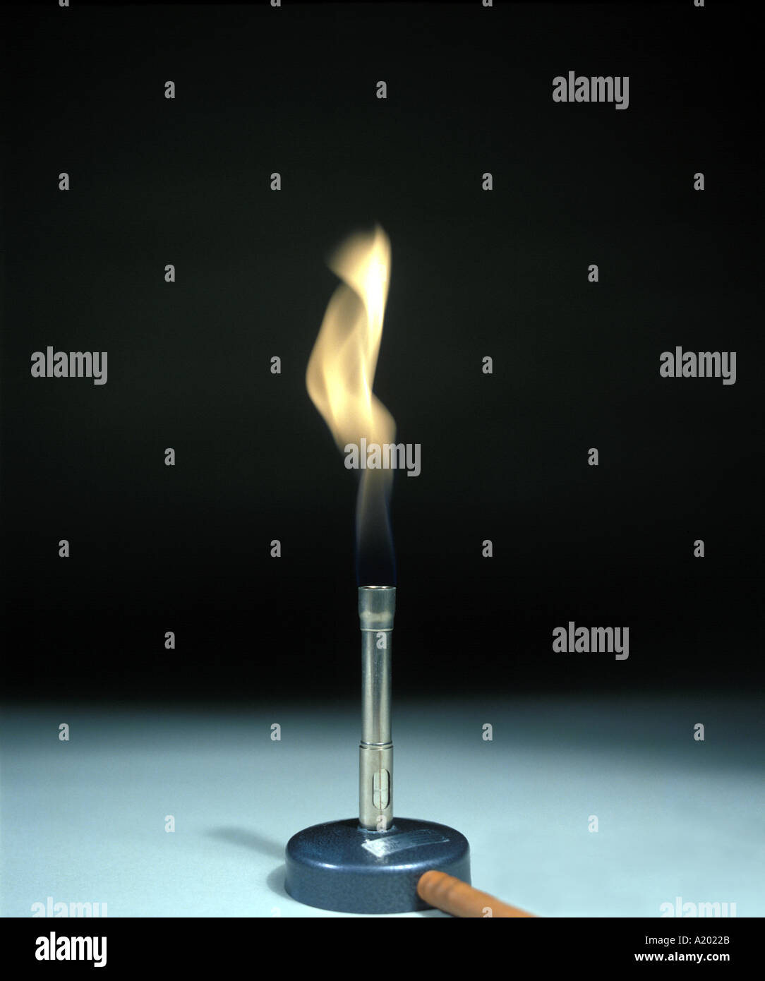 bunsen burner has a sooty yellow flame when the air hole is closed Stock Photo