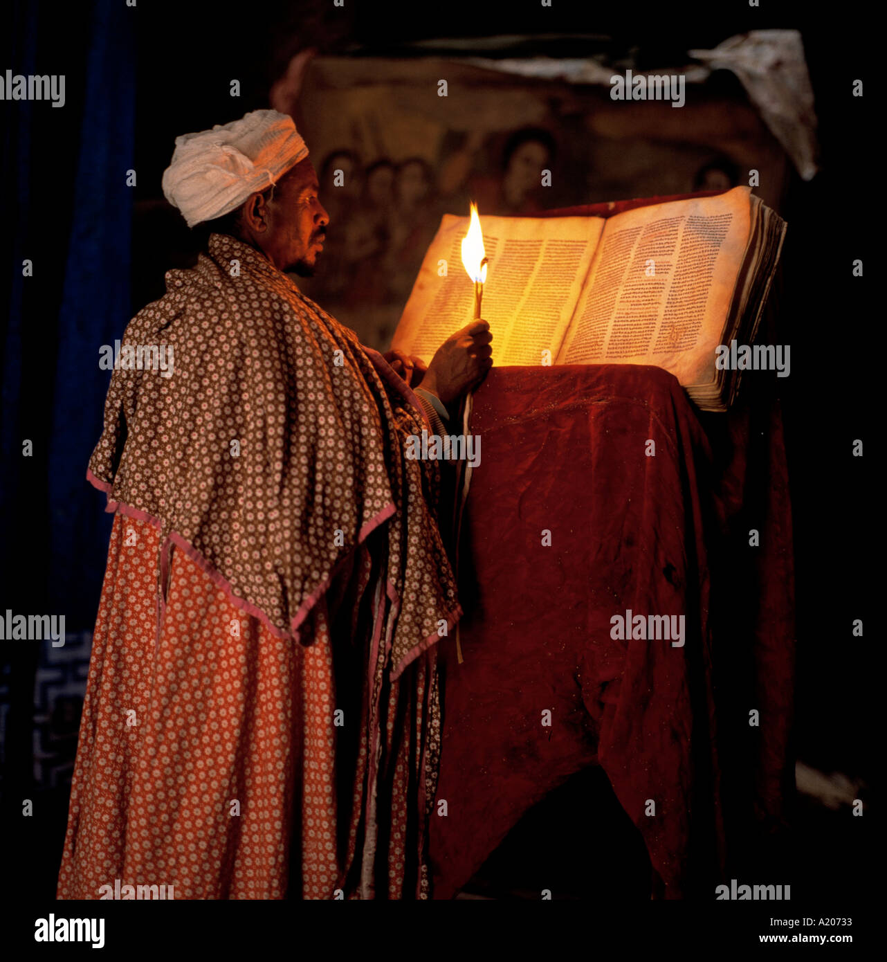 Priests in the underground Church of St George Lalibela Stock Photo