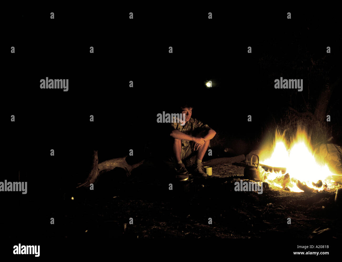 At a camp fire in the moon light Stock Photo