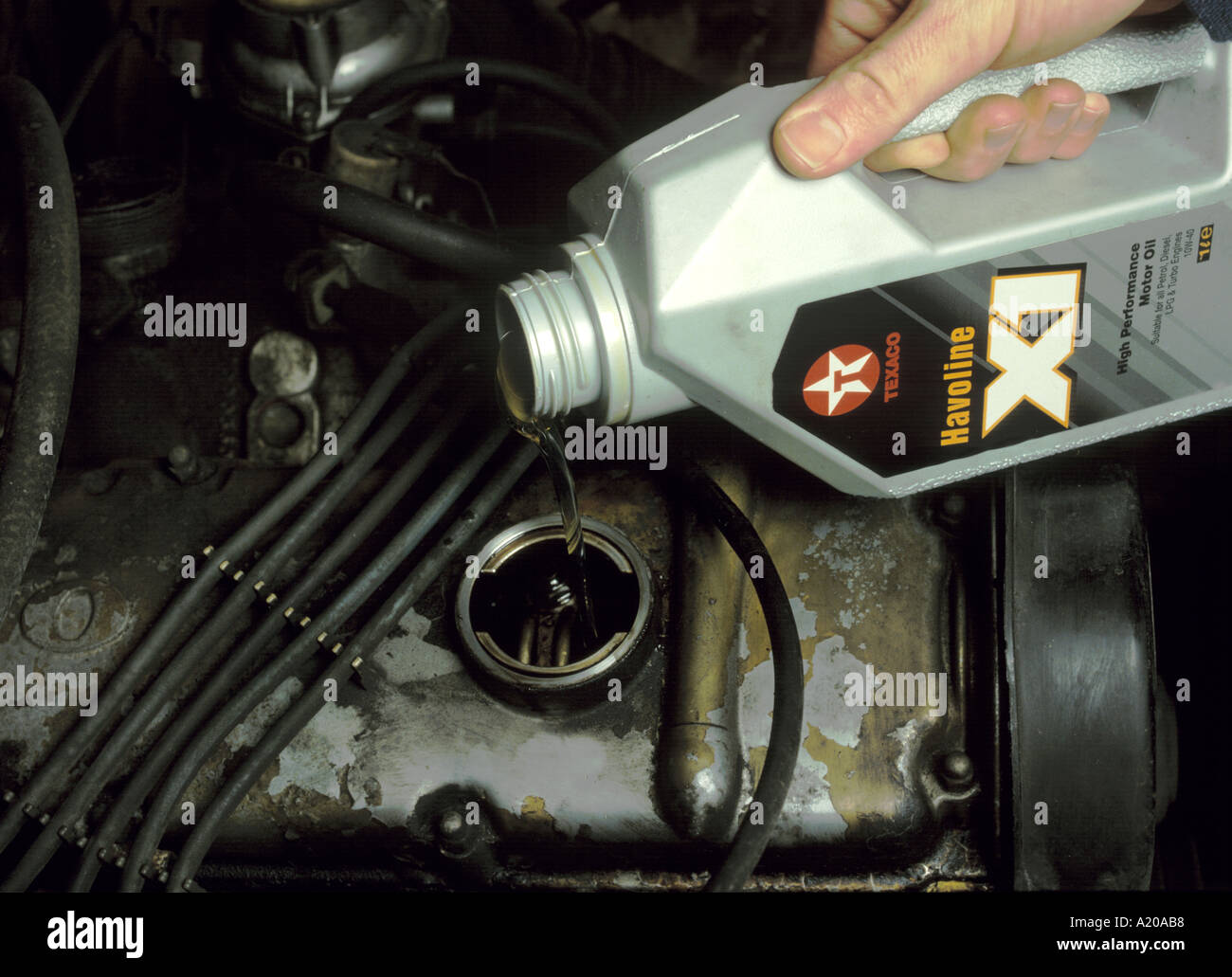 oil being poured into a car engine Stock Photo Alamy