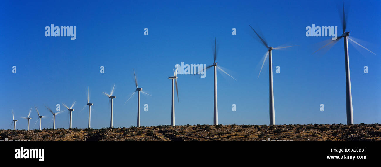 Wind turbines against blue sky Stock Photo - Alamy