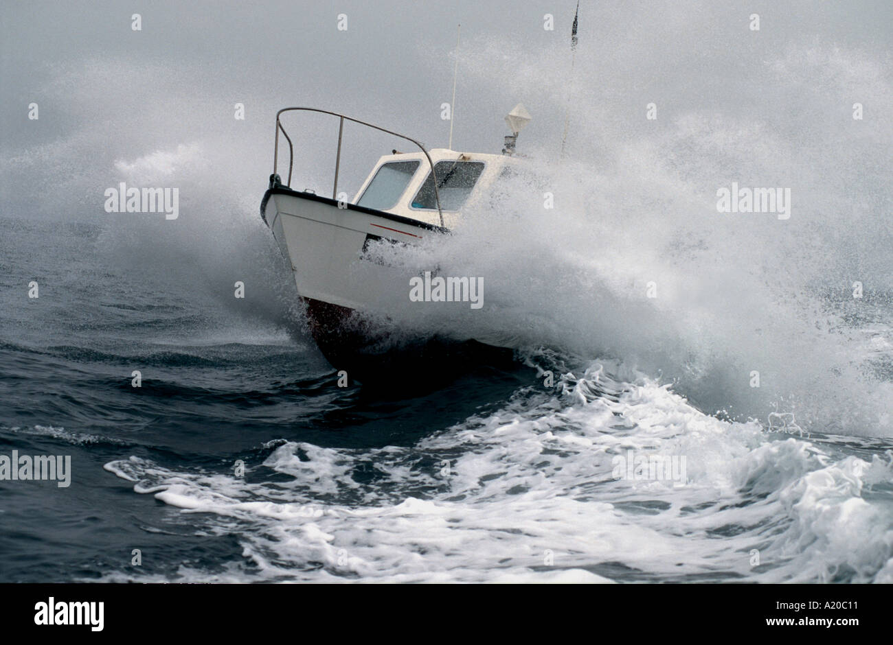 A small fishing boat in a storm at sea Stock Photo - Alamy