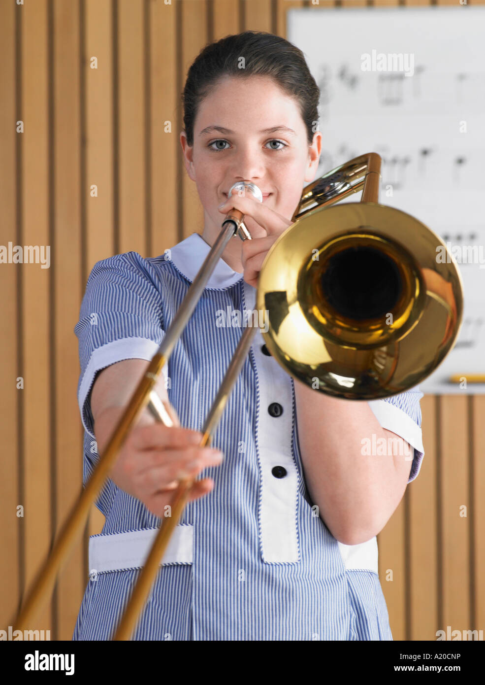 High school girl playing trombone in music class, portrait Stock Photo