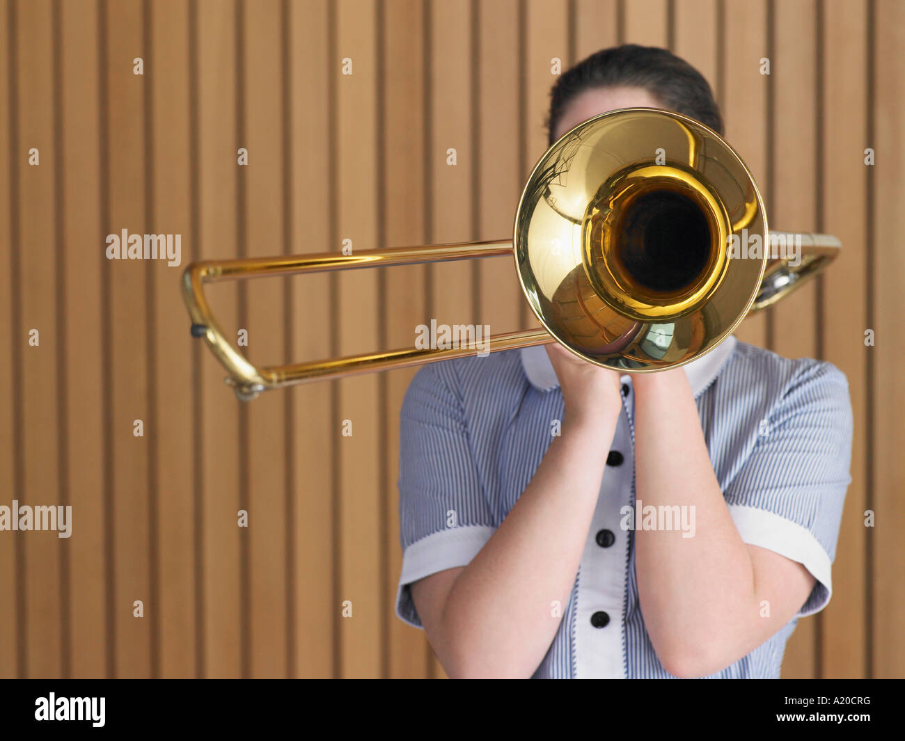 High school girl playing trombone in class, portrait Stock Photo Alamy