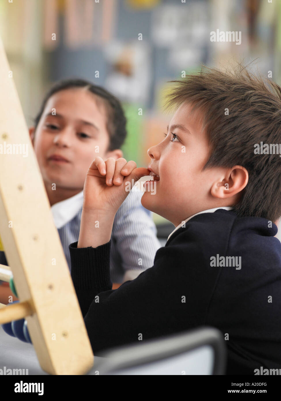 Elementary students sitting in classroom Stock Photo - Alamy