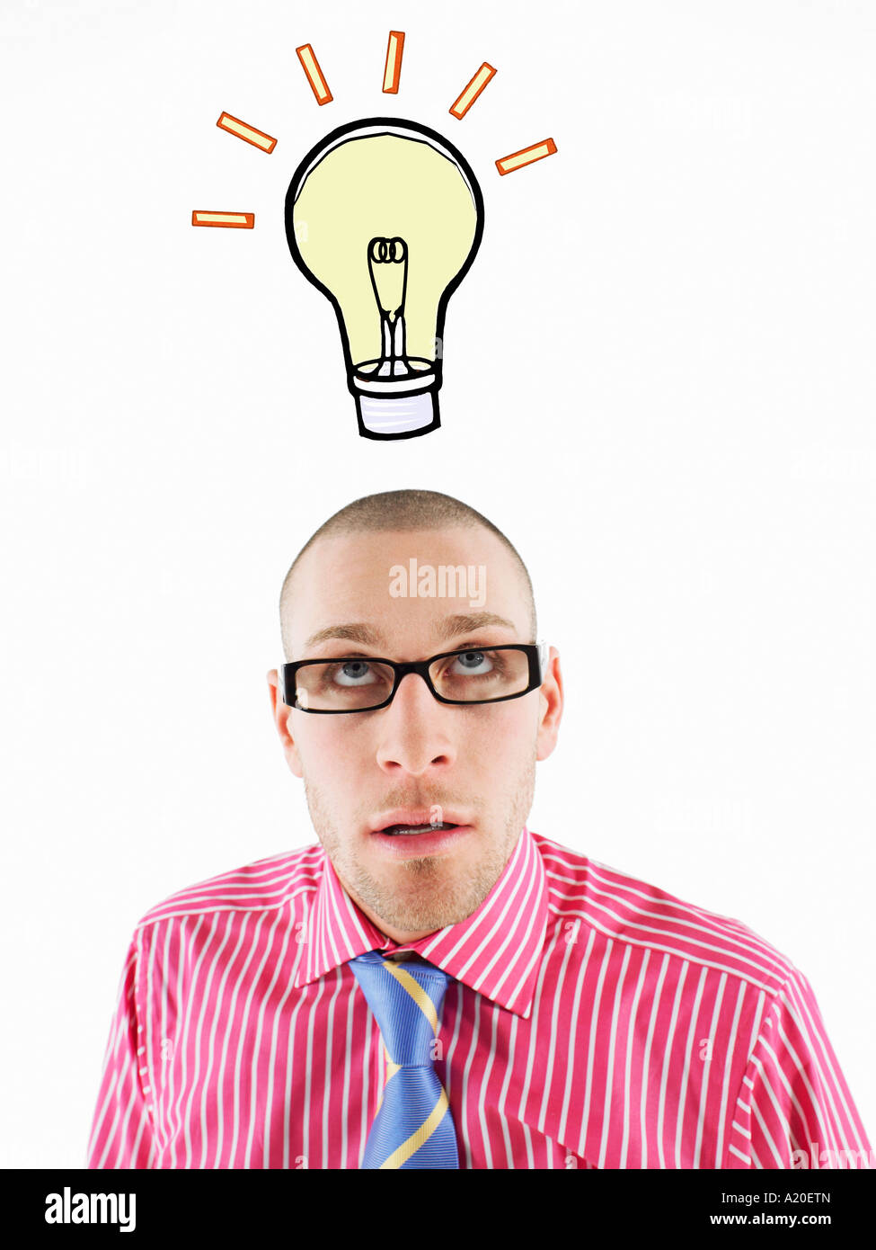 Man in glasses looking up, head and shoulders, below illustrated light bulb Stock Photo