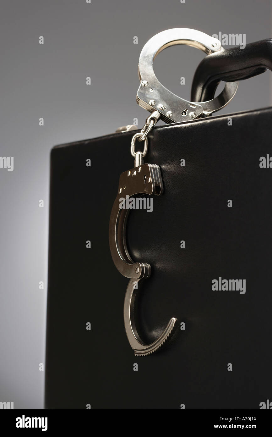 Handcuffs attached to briefcase hires stock photography and images Alamy