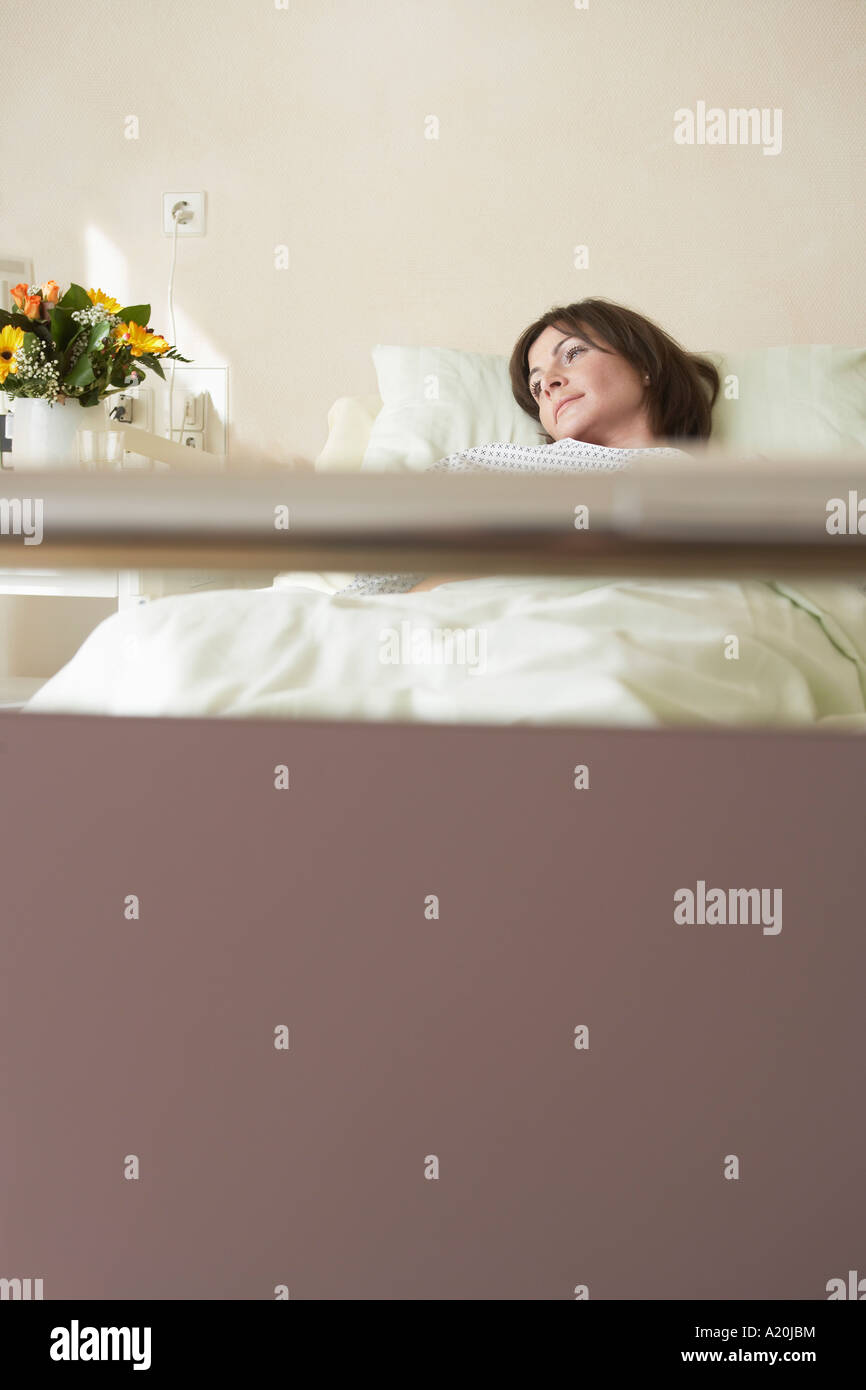 Patient Resting in Hospital Bed, view from end of bed Stock Photo Alamy