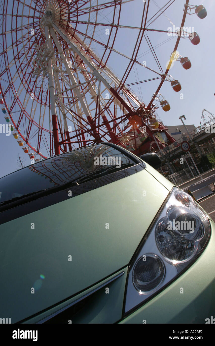 A Toyota Estima hybrid vehicle on the test drive track outside Toyota Megaweb, a big wheel in the background, Tokyo, Japan Stock Photo