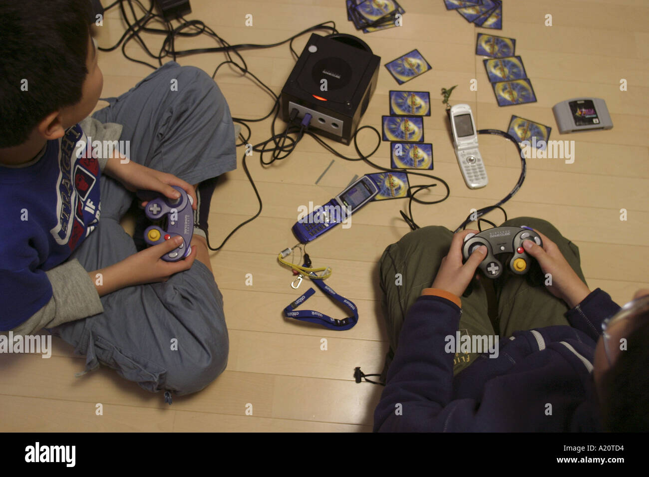 Japanese children playing Nintendo Gamecube and Gameboy, Tokyo, Japan Stock Photo