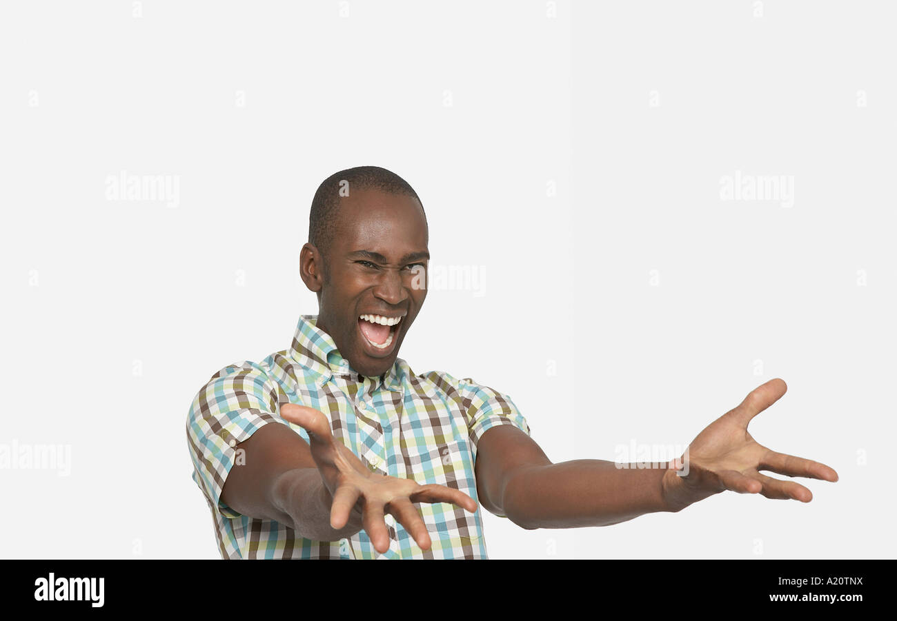 Enthusiastic Man smiling big, arms stretched out in front, palms up Stock  Photo - Alamy