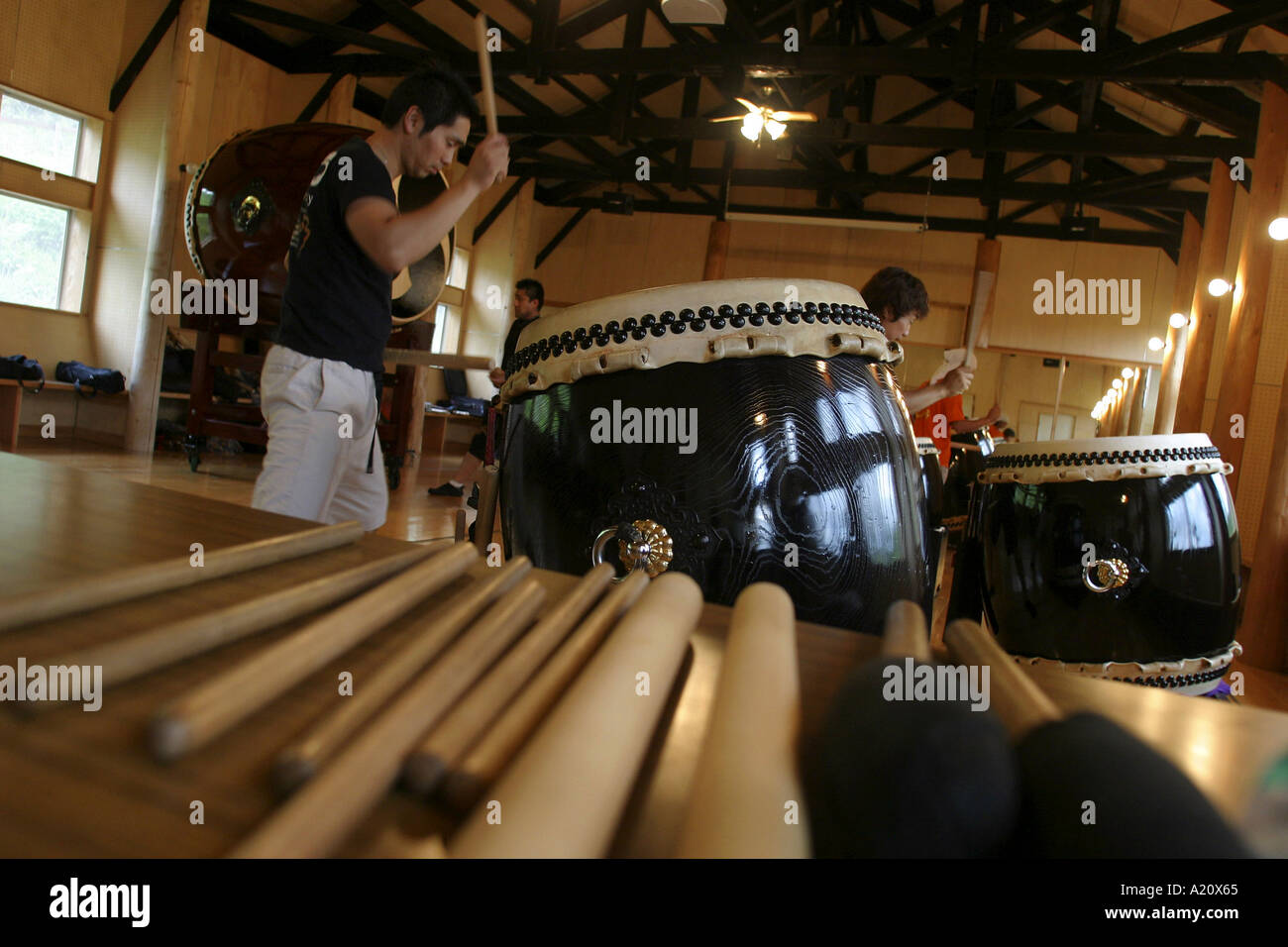 TAO Drummers performing at the gymnasium of their home at Grandioso on Mount Kuju, Kyushu, Japan. Stock Photo