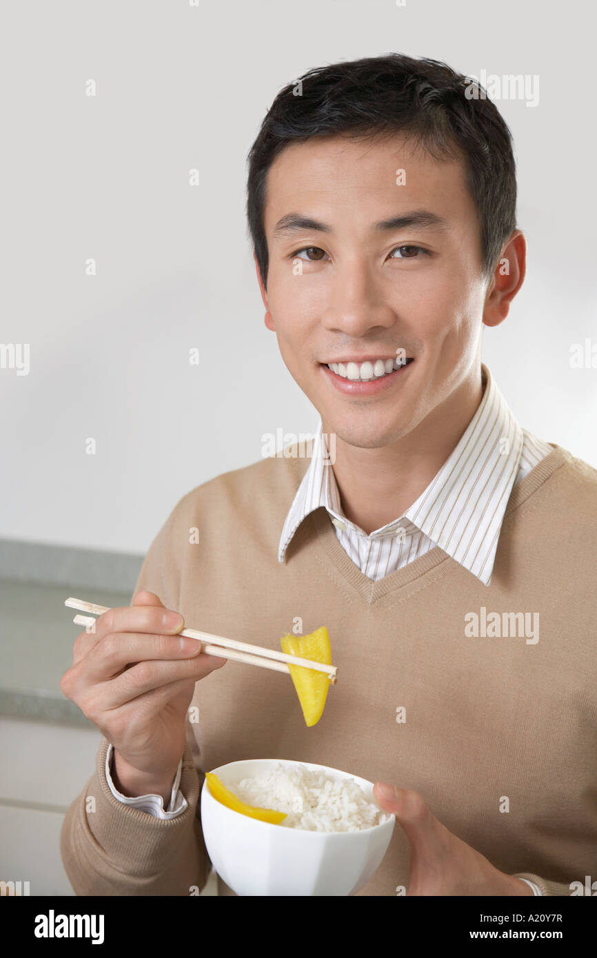 Chinese Man Smiling With Rice