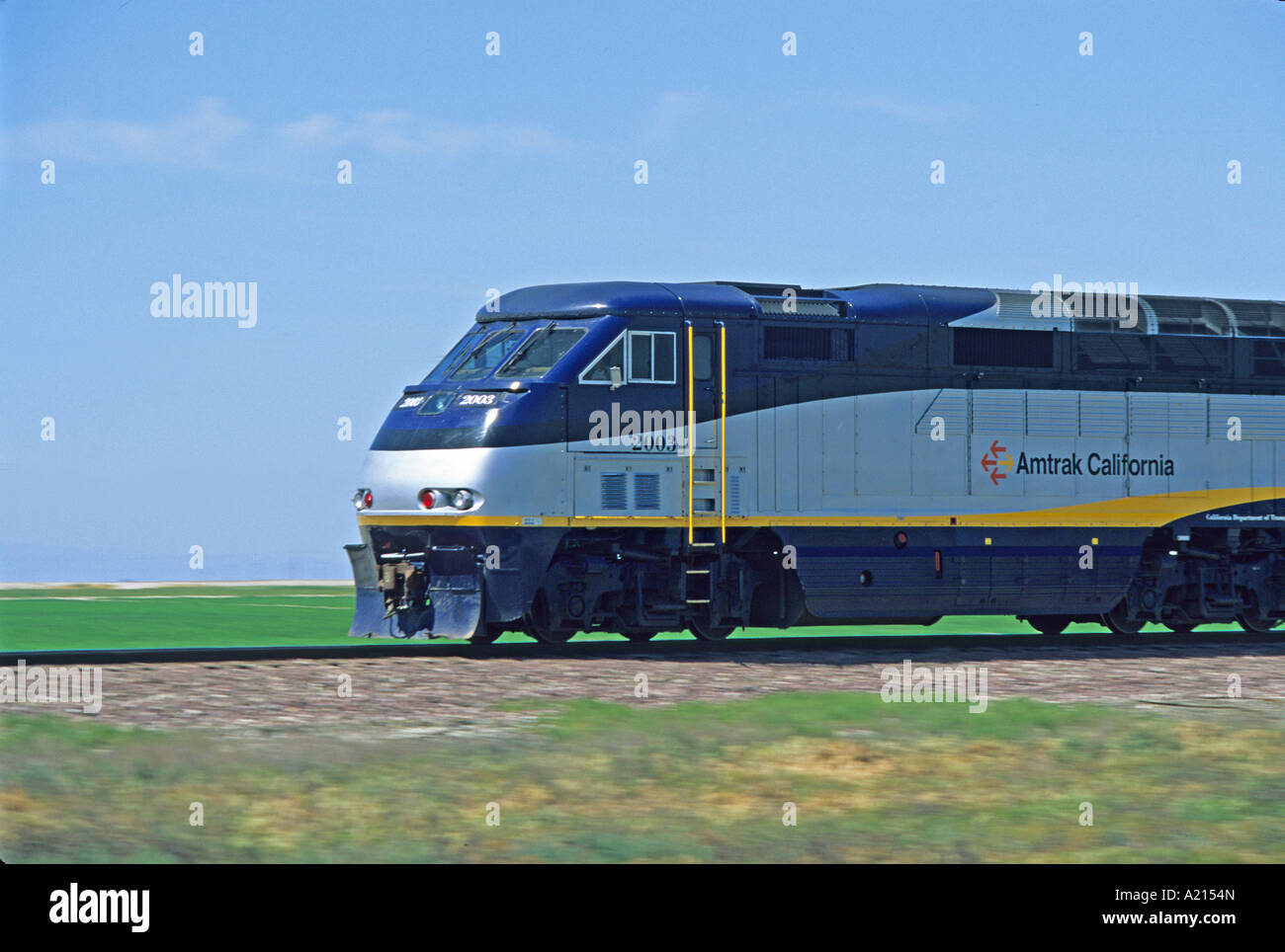 AmTrak train locomotive moving over tracks California Stock Photo
