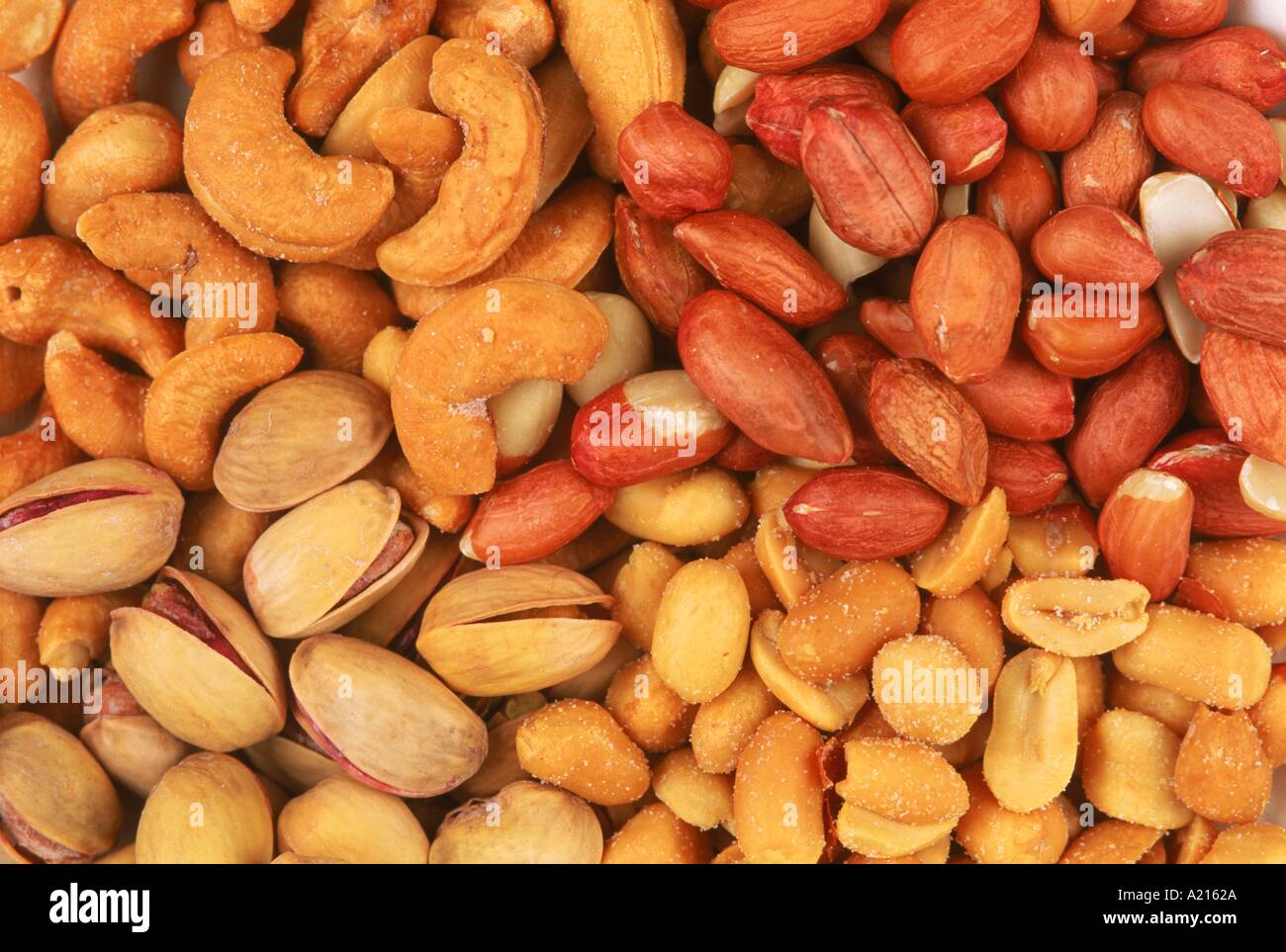 Peanuts cashews and pistachios some salted in a display of mixed nuts L Frost Stock Photo