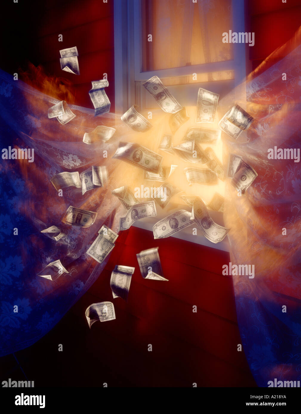 money flying out the window Stock Photo - Alamy