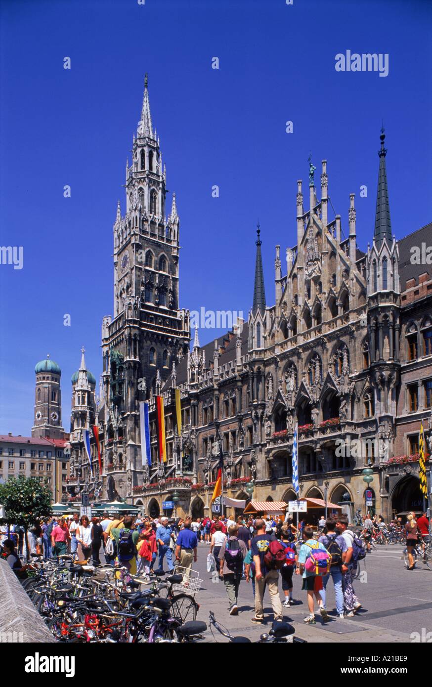 Tourists on the Marienplatz in front of the New Town Hall in the city of Munich Bavaria Germany H P Merten Stock Photo